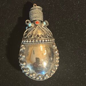 Silver pouch pendant
